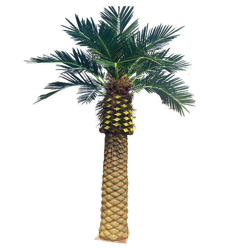 Artificial date palms used as tropical landscaping at a theme park entrance