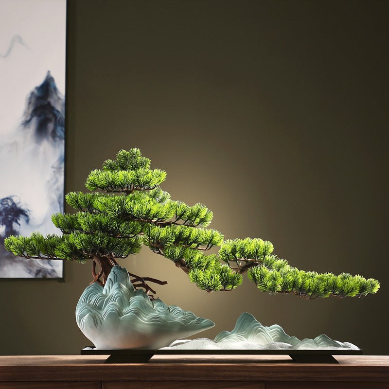 The bonsai held in one hand, showing just how small the 1.2ft tree is