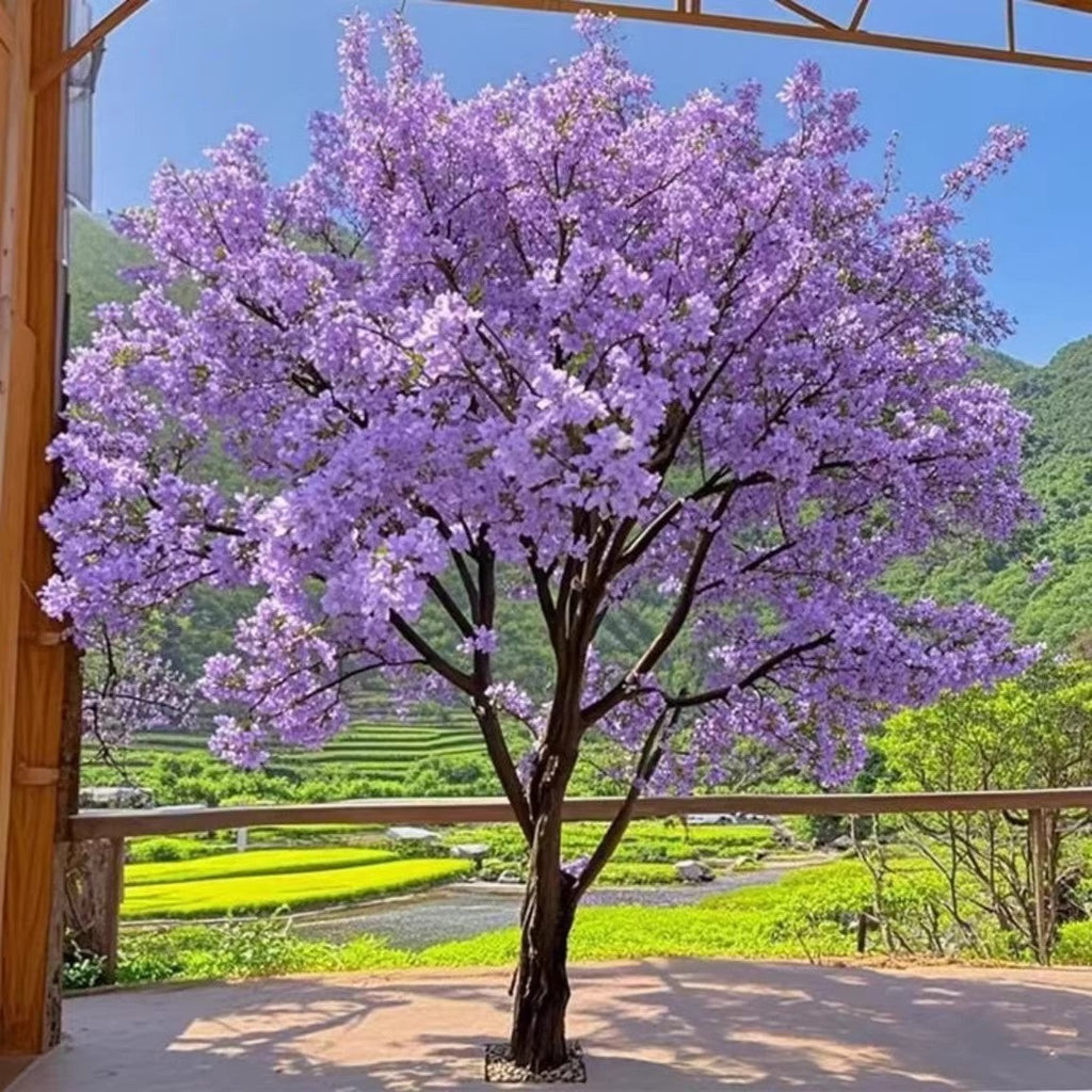 Large purple artificial blossom tree, silk flowers massed along its flocked branches