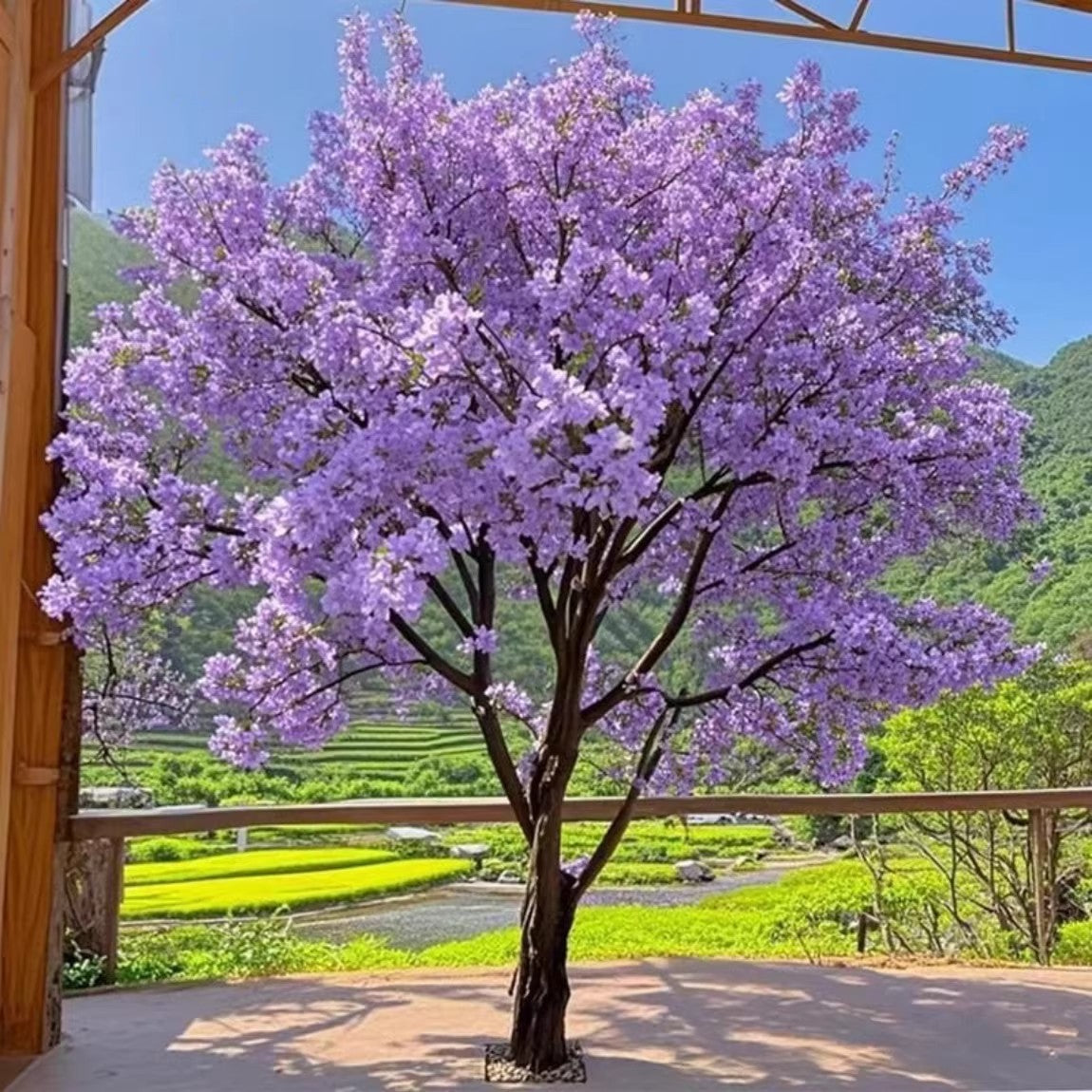 Large purple artificial blossom tree, silk flowers massed along its flocked branches