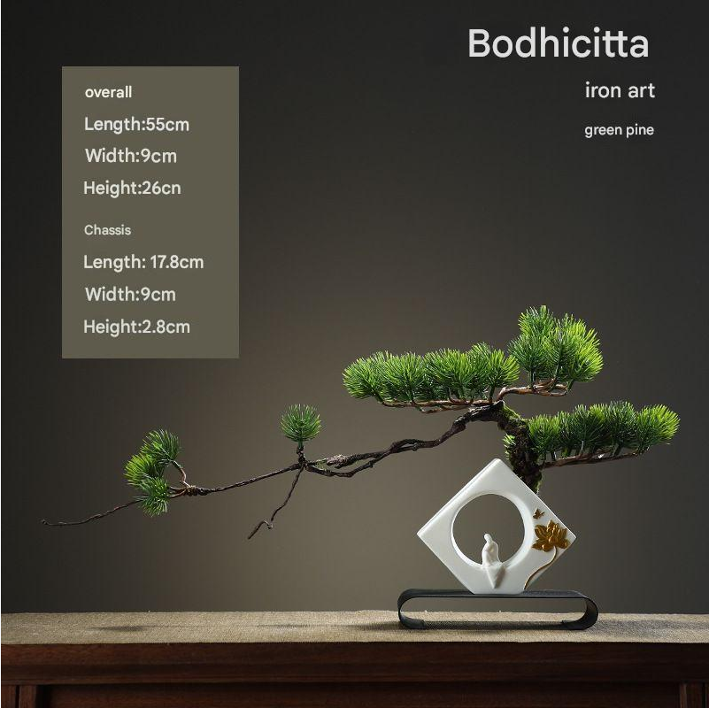 The 24in bonsai used as indoor decor set on a low wooden side table