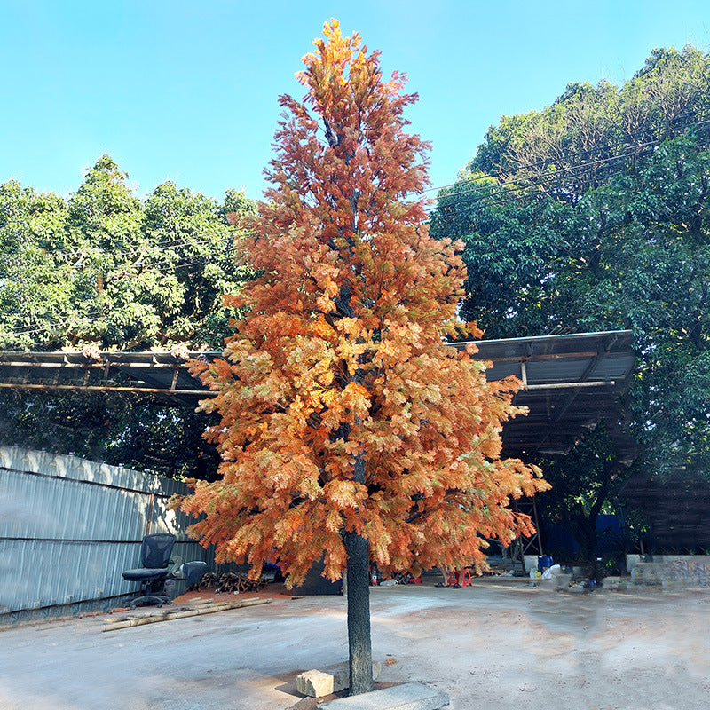 Artificial cedar tree with layered evergreen foliage on a natural wood trunk