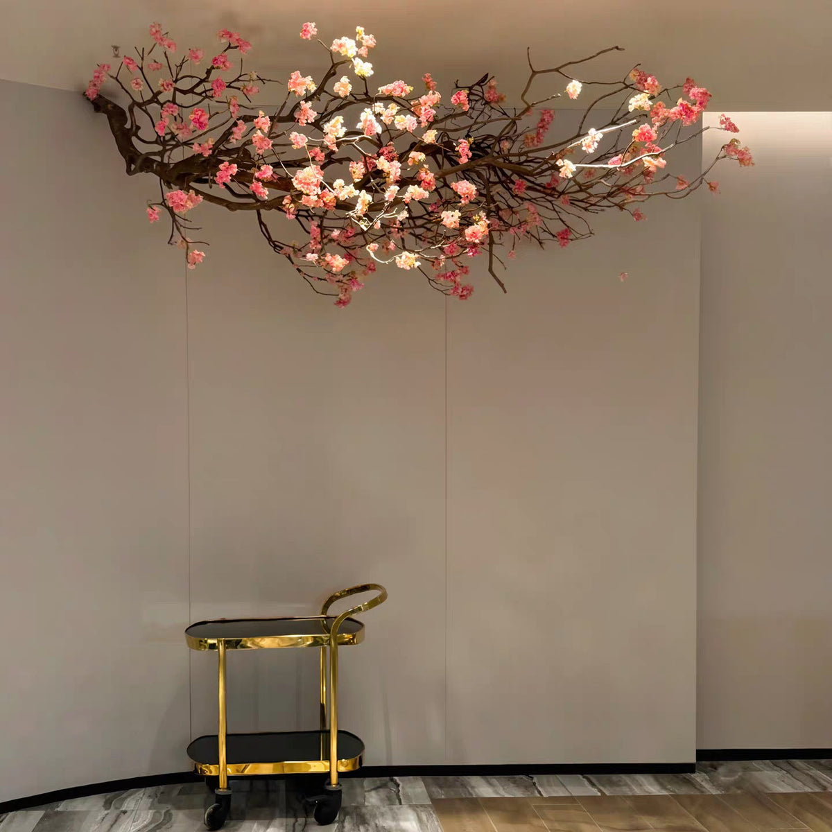 The hanging branch fixed to a wall as a floral decoration in a restaurant