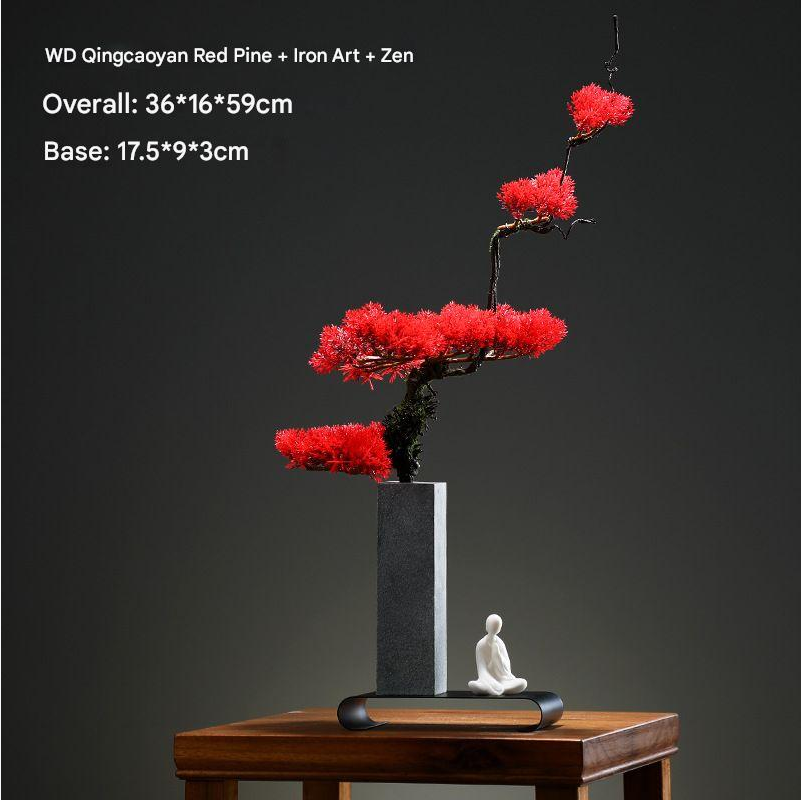 The 24in bonsai shown beside a hand to give a sense of its size