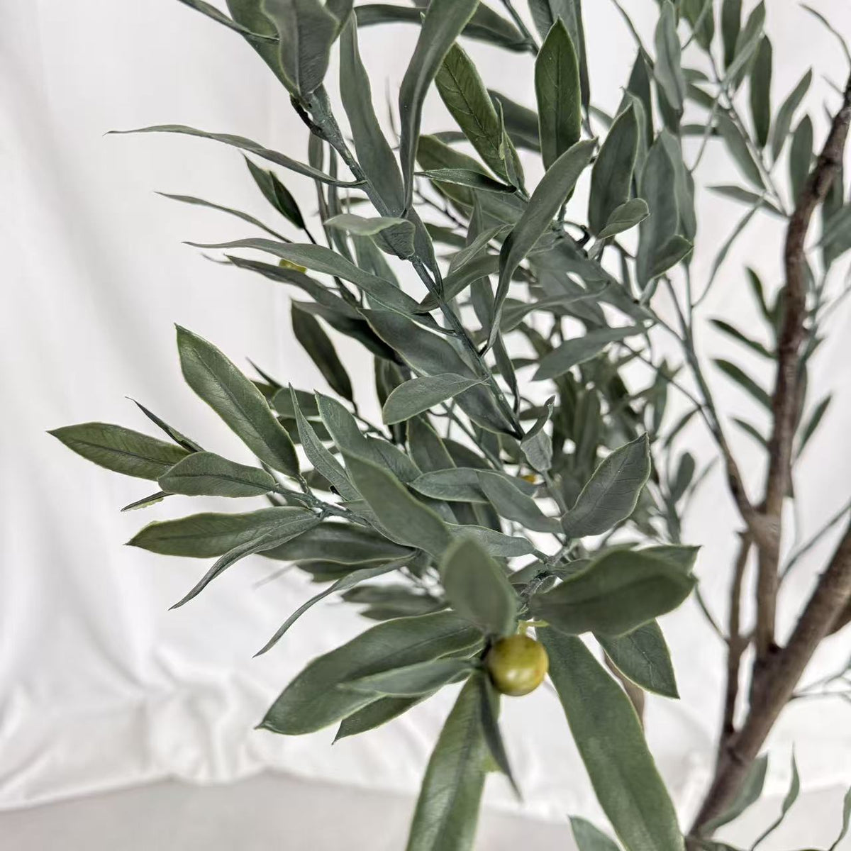 The 4ft and 6ft artificial olive trees shown together for height comparison