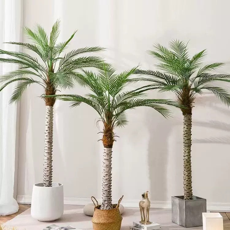 Artificial areca palm with feathered fronds arching out from a cluster of cane stems