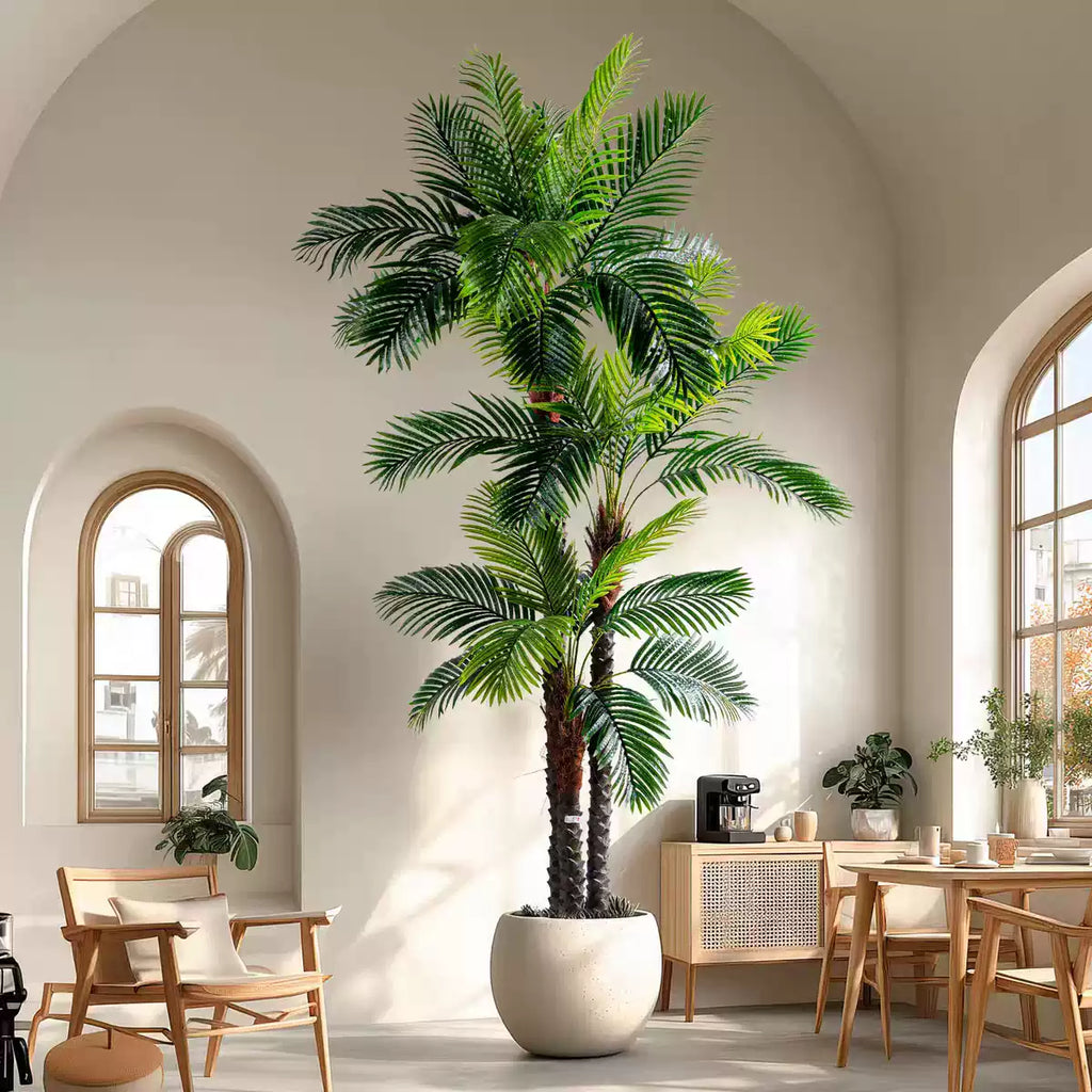 Artificial palm tree styled for commercial interiors, fronds arching from a bare trunk