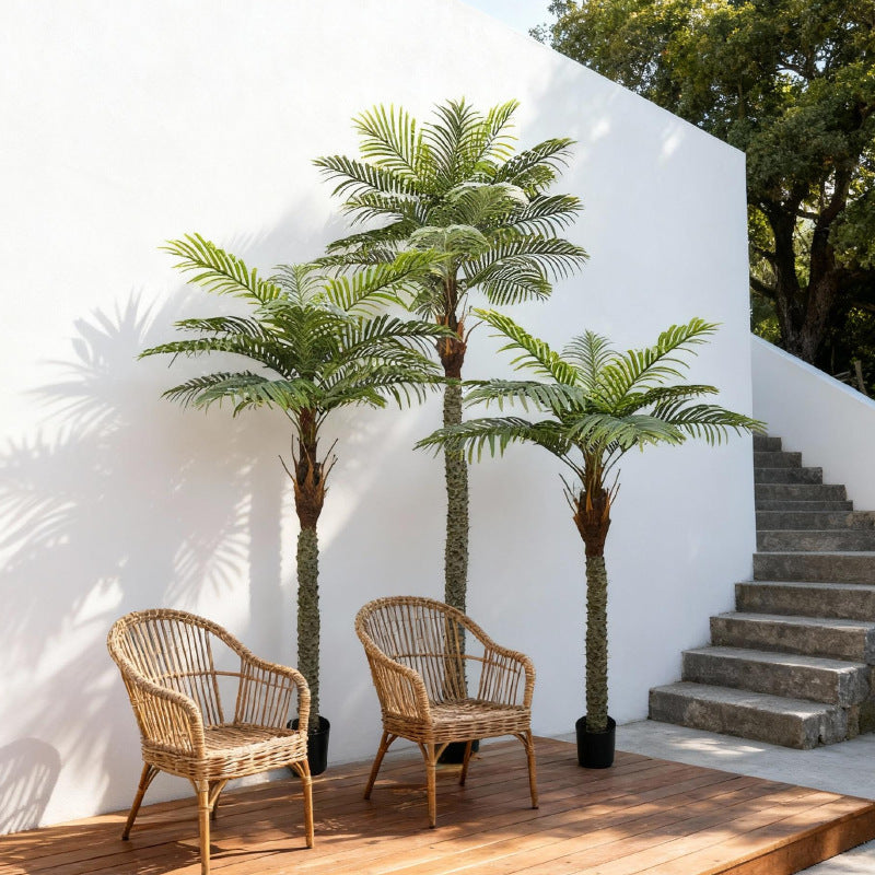 Tall faux date palm in a plain pot, stiff fronds radiating from a fibrous trunk