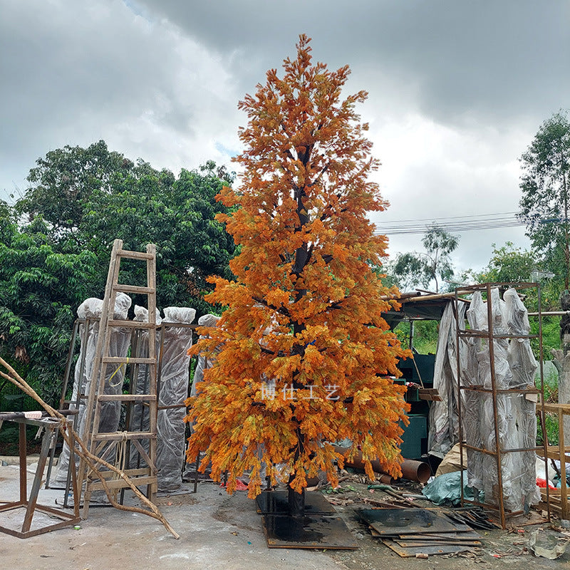 Base of the artificial cedar where the wood trunk sets into its planter