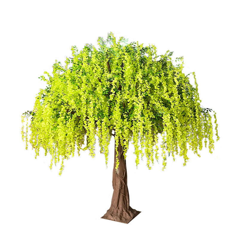 Trunk and base of the artificial wisteria tree where it stands on the floor