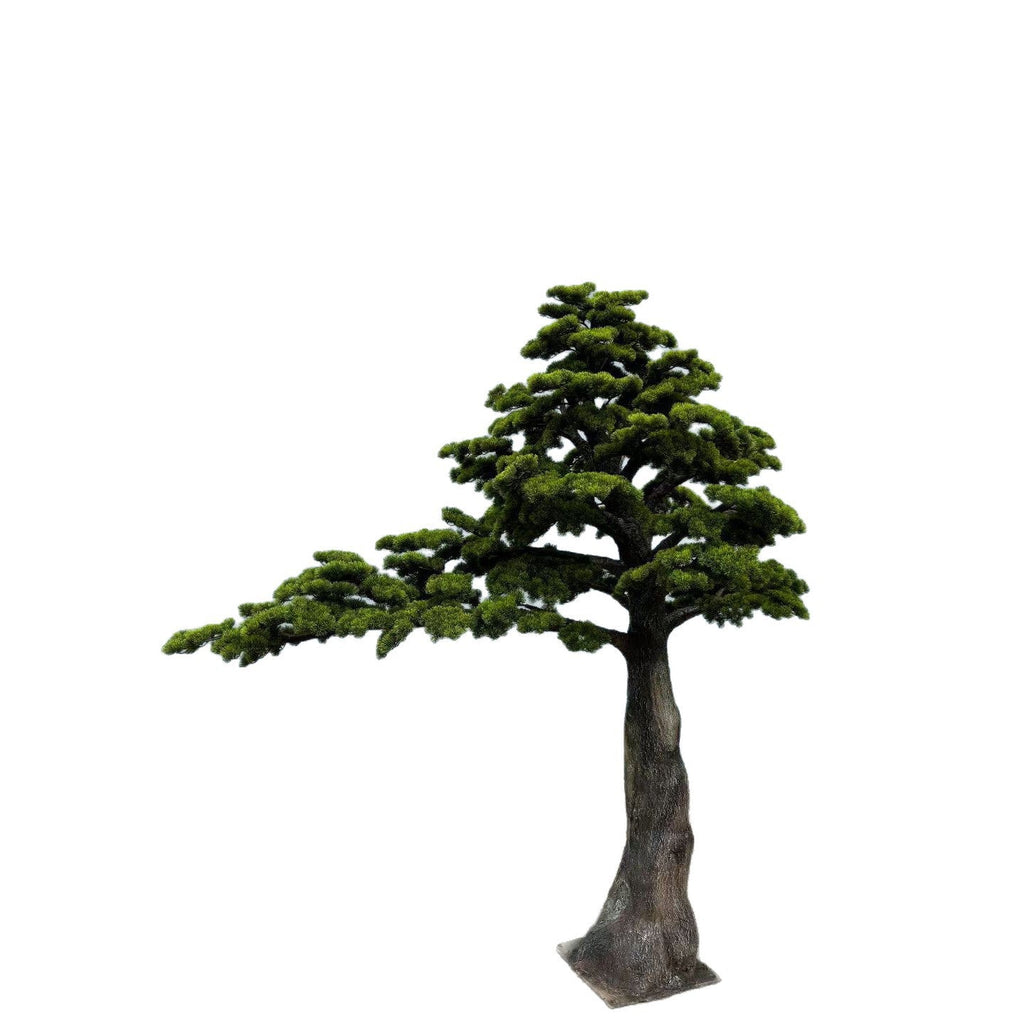 The faux pine bonsai staged as a photo prop against a plain studio backdrop