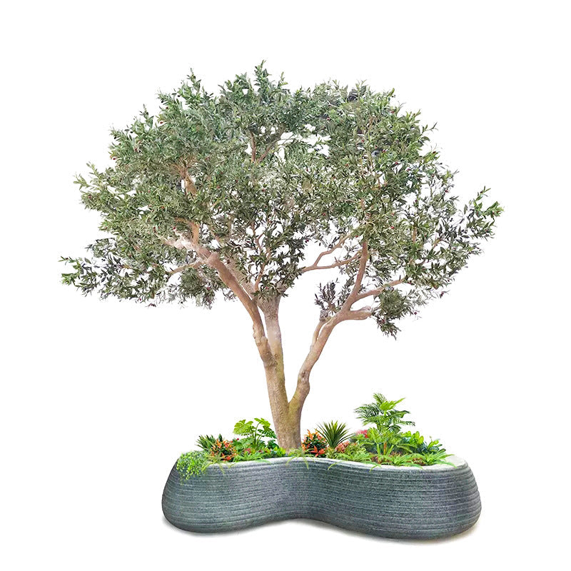 Soil surface and moss finish at the base of the potted artificial olive tree