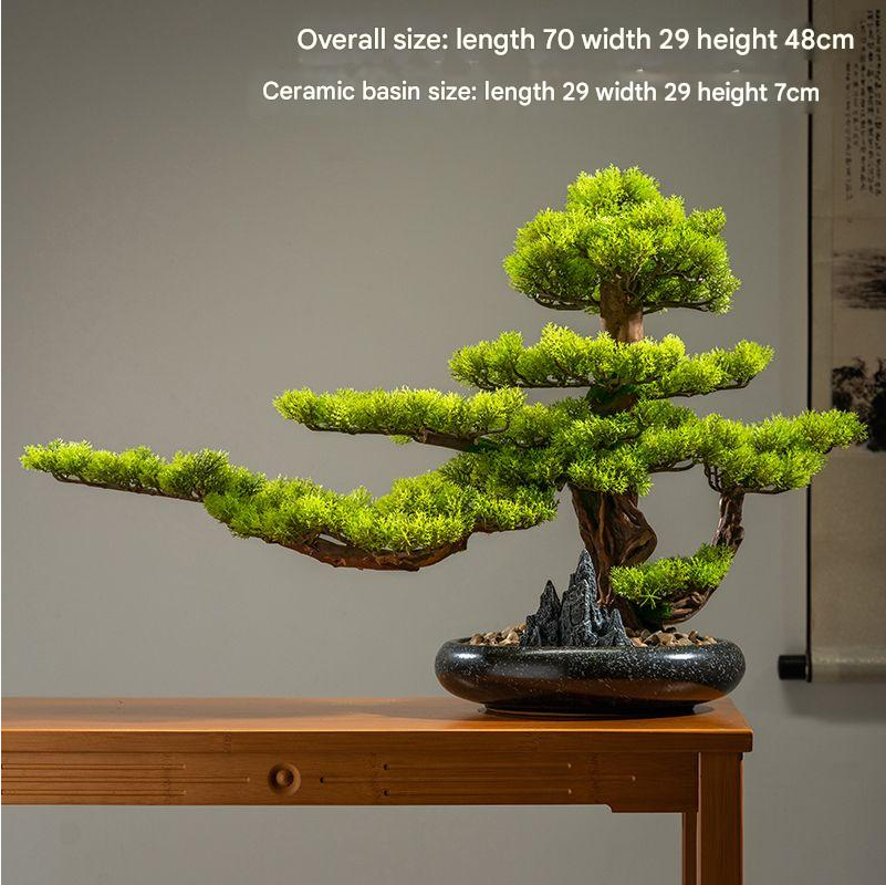 Two of the artificial cliff cypress trees displayed side by side