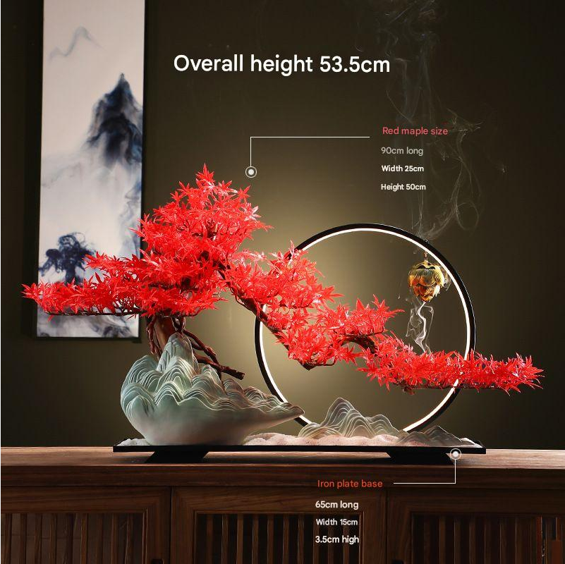 The bonsai seen from the side, its branches reaching out past the pot