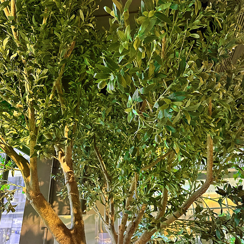 The trunk of the 10ft artificial olive tree, textured with deep gnarled bark