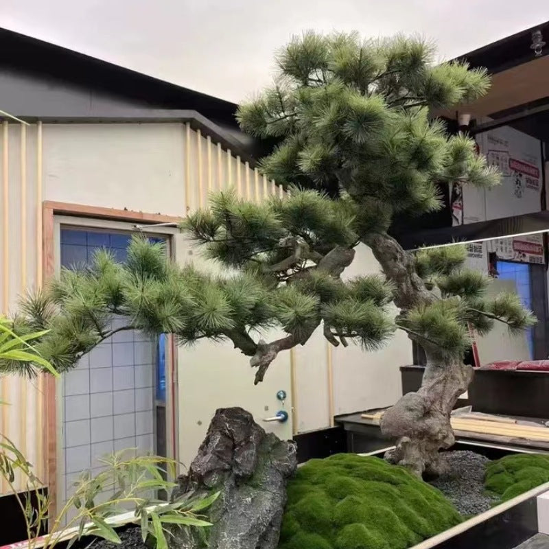 The faux pine used as an entryway statement tree in a mall interior landscape