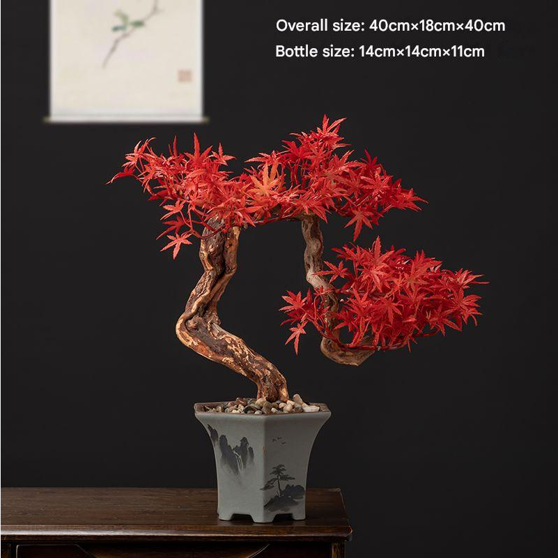 Artificial pine bonsai in deep green, branches layered into flat trained pads