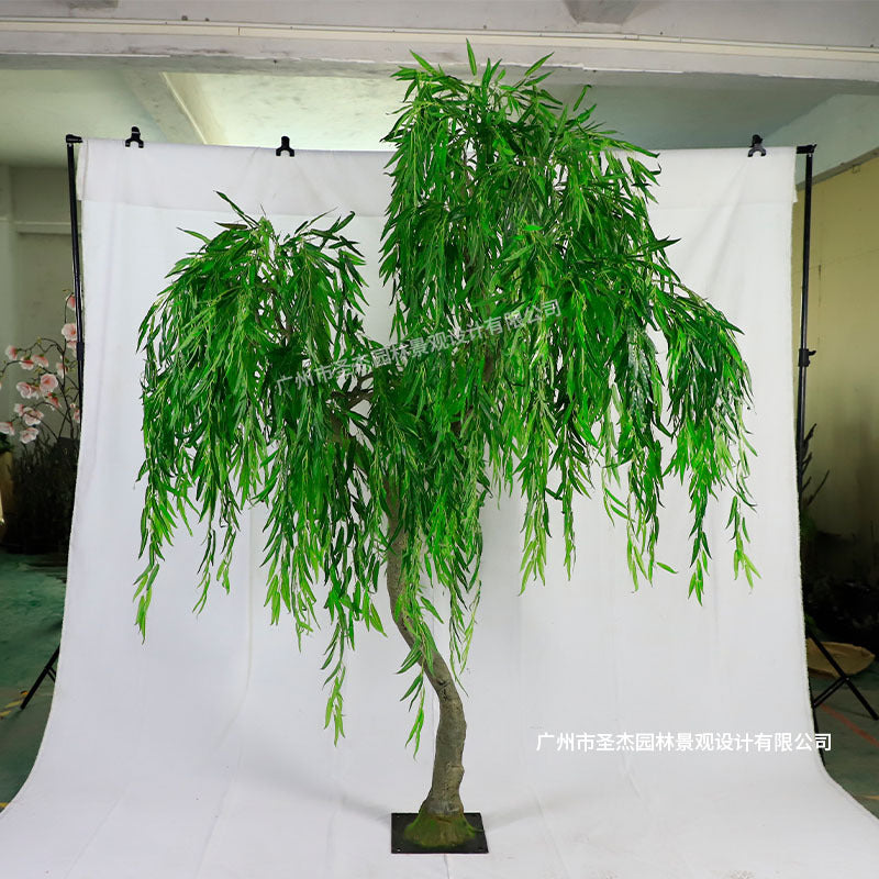 Artificial weeping willow 7ft tall, long trailing branches falling from a resin trunk