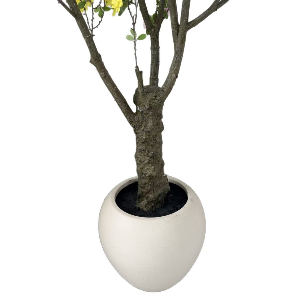 The trunk and branch frame of the 6.5ft begonia tree beneath the flowers