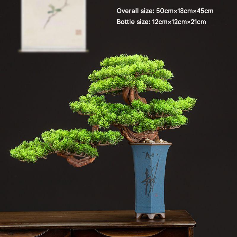 The bonsai used as a green accent on a console table in a hallway