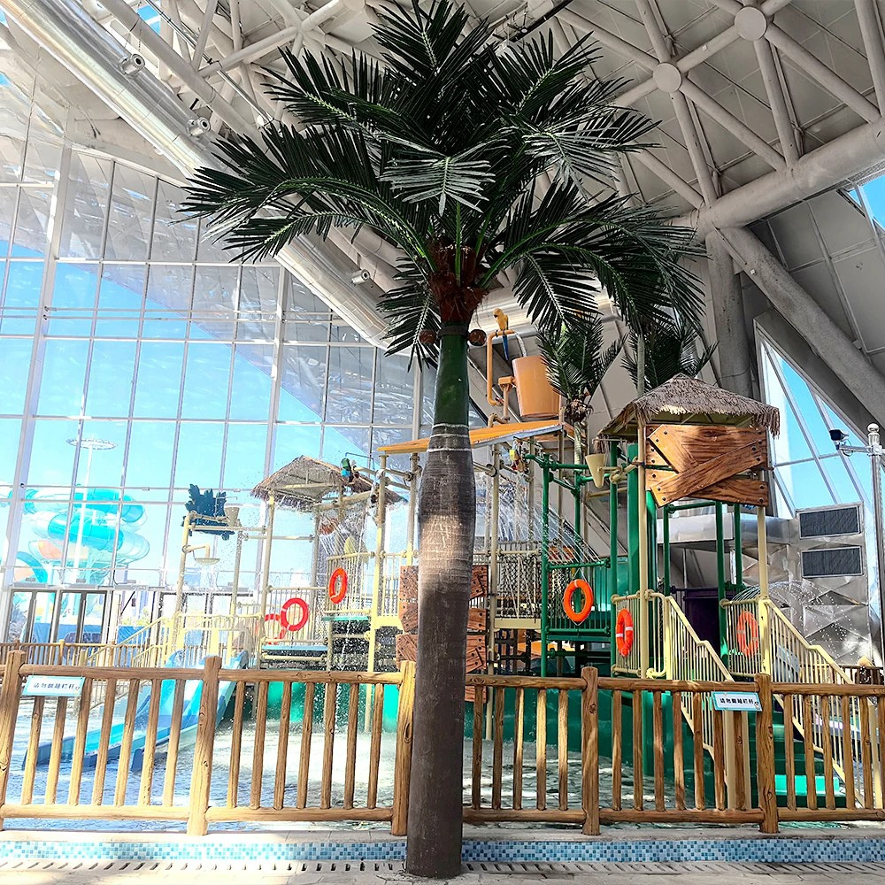 Large UV-resistant artificial coconut tree, broad fronds spreading at the crown