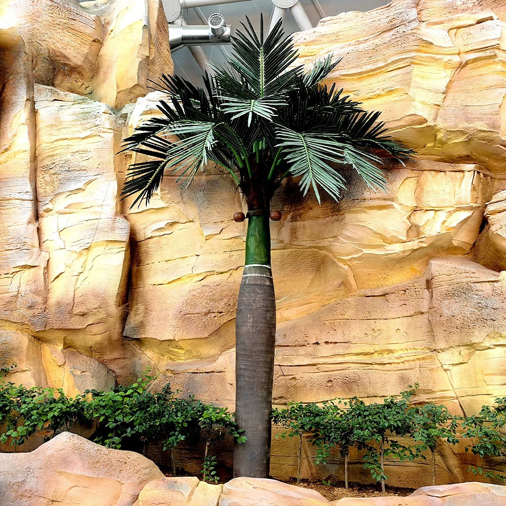 The coconut tree used indoors as a tall tropical feature in a lobby