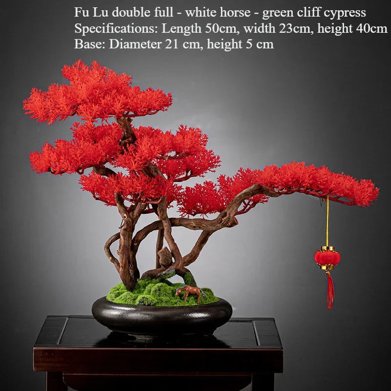 The lowest branch pad reaching out over the rim of the bonsai pot