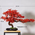 Artificial pine bonsai for a Zen landscape, branches trained into flat green pads