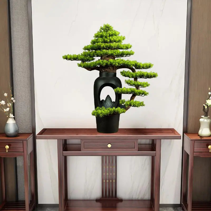 The sculpted trunk of the 3ft bonsai curving up from its display pot