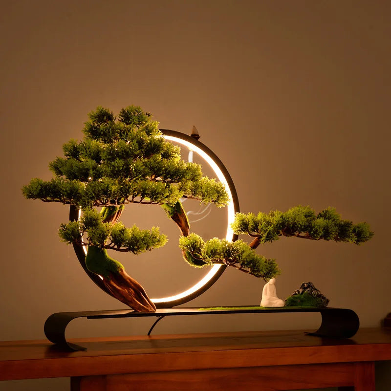 The 1.7ft bonsai shown beside a hand to give a sense of its size