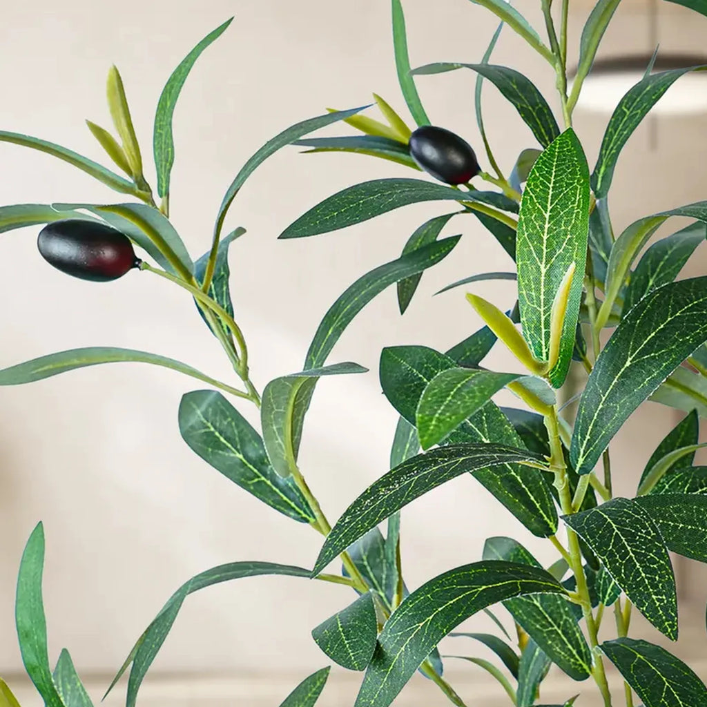 Alternate view of the artificial olive tree with a natural wood trunk in a pot