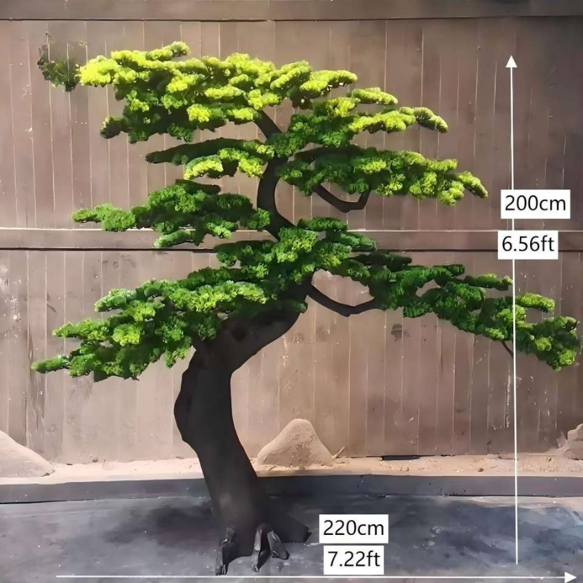 Base and pot of the artificial cedar bonsai, finished with moss and stones