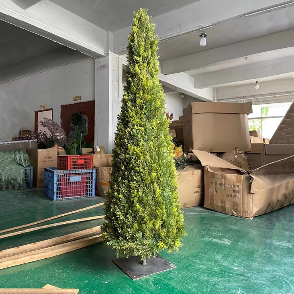 Artificial conical topiary 8ft tall, clipped into a tall tapering green sculpture