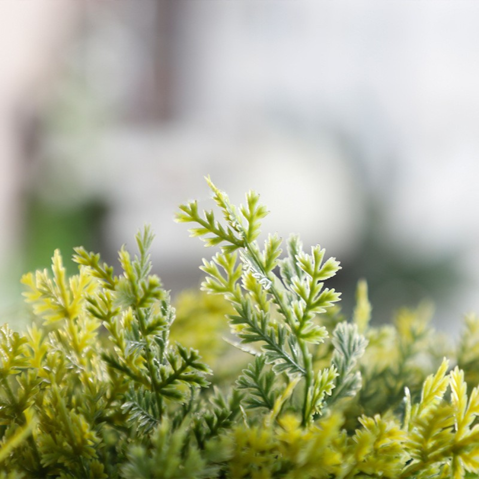 The slim stem between the topiary balls on the 1.5m artificial cypress tree