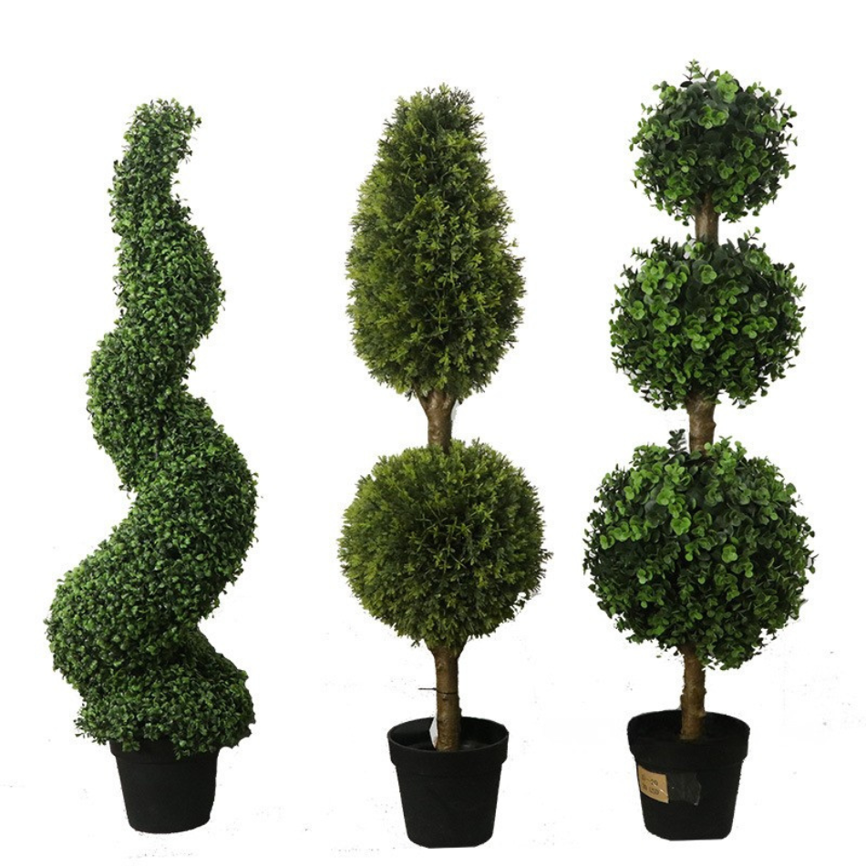 A pair of topiary balls used as entryway greenery at an office entrance