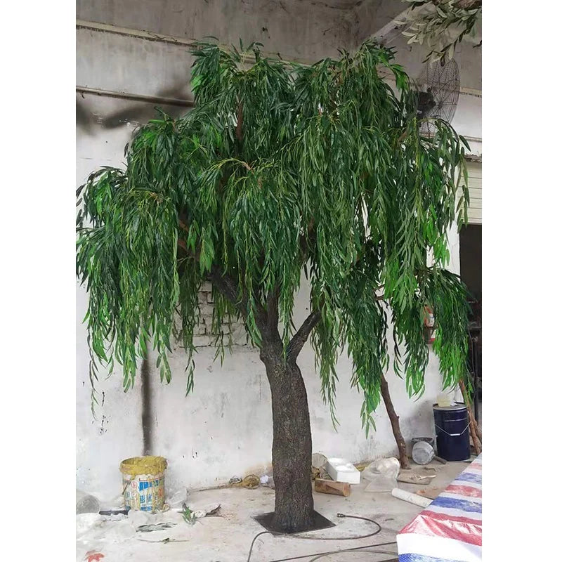 The trunk of the 13ft willow rising into its canopy of hanging branches