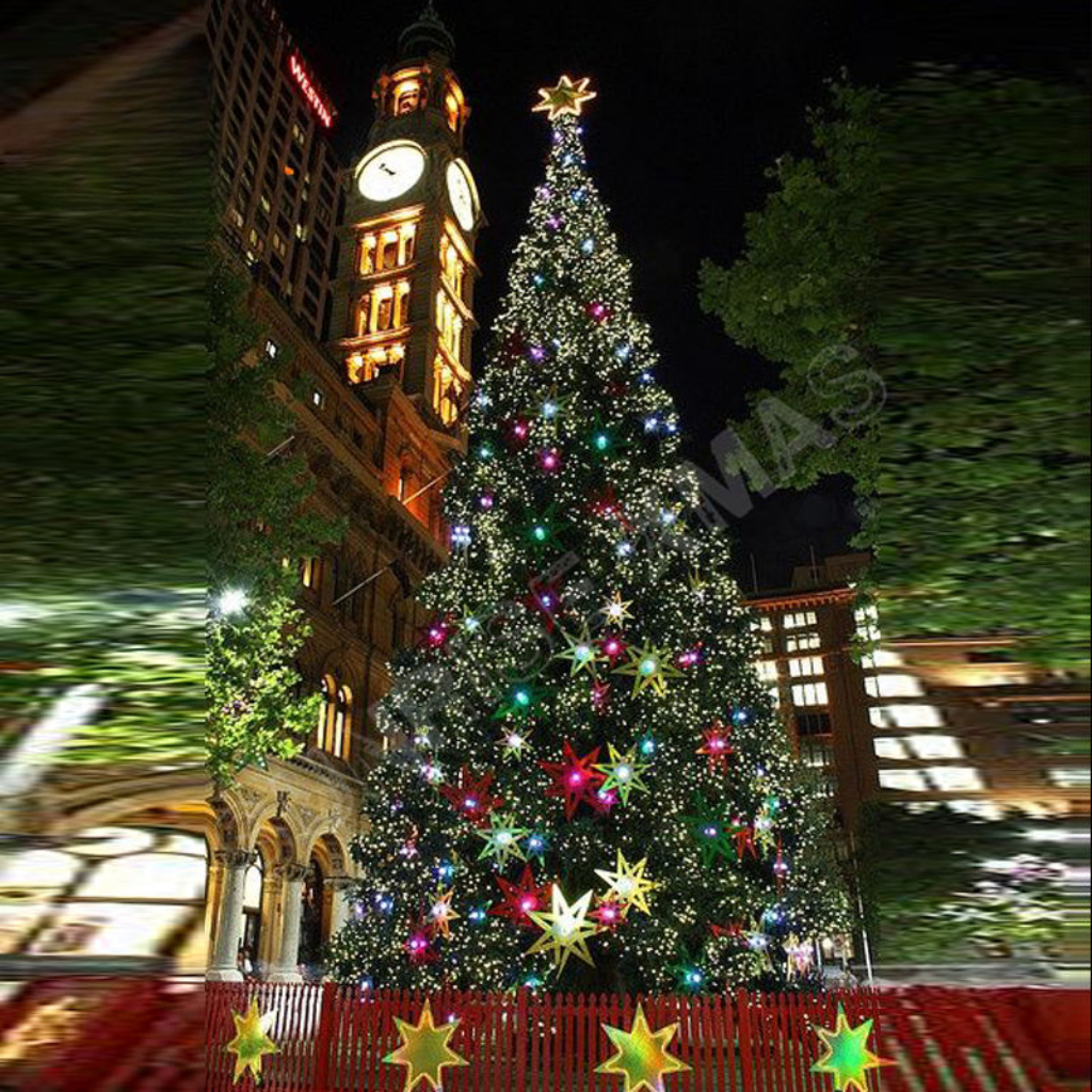 Giant artificial Christmas tree outdoors, its DMX lighting synced to run a music show