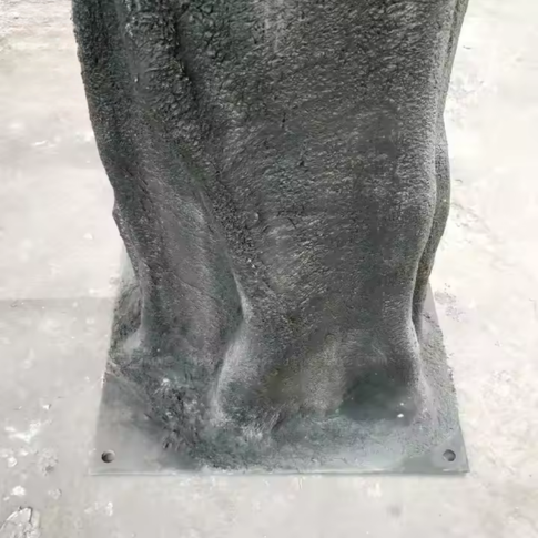 Base of the silk cherry blossom tree where the trunk meets its planter
