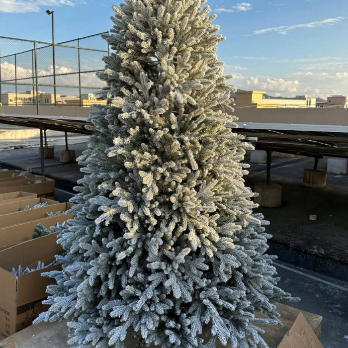The white Christmas tree dressed for a luxury indoor holiday display