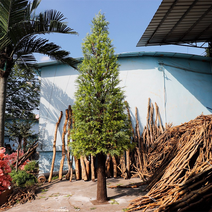 Artificial cypress tower 4.5m tall, clipped into a tall column on a wood trunk