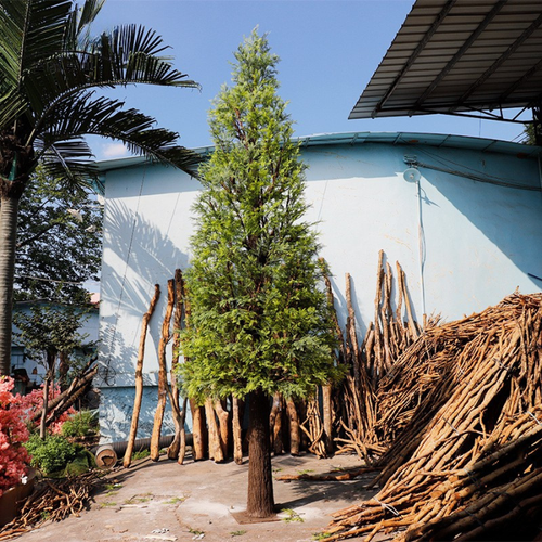 Artificial cypress tower 4.5m tall, clipped into a tall column on a wood trunk