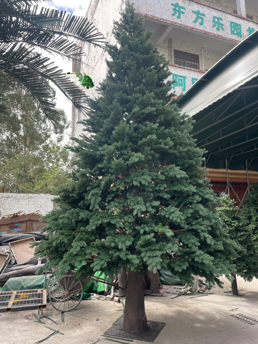 Artificial Christmas tree 20ft (6m) tall, realistic wood branches under green foliage