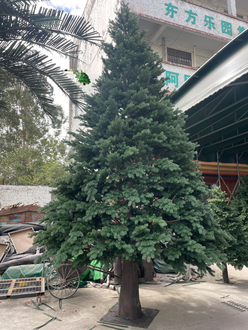 Artificial Christmas tree 20ft (6m) tall, realistic wood branches under green foliage