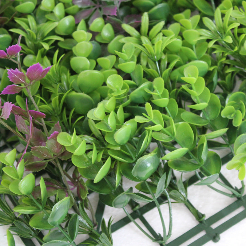 Green grass wall panels covering a full feature wall in a commercial reception area