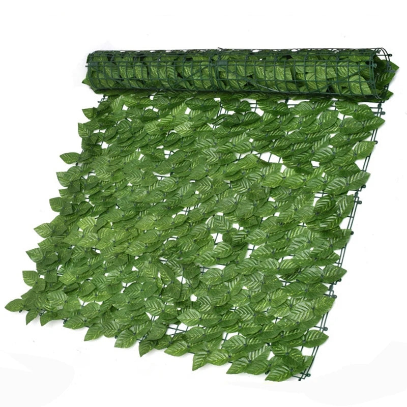 Artificial ivy leaf fence roll unrolled as a privacy screen, dense with green foliage