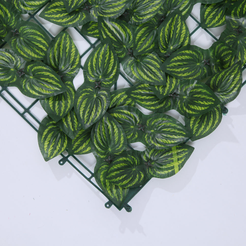 Ivy panels hung together to make a continuous green screen wall in a hotel lounge