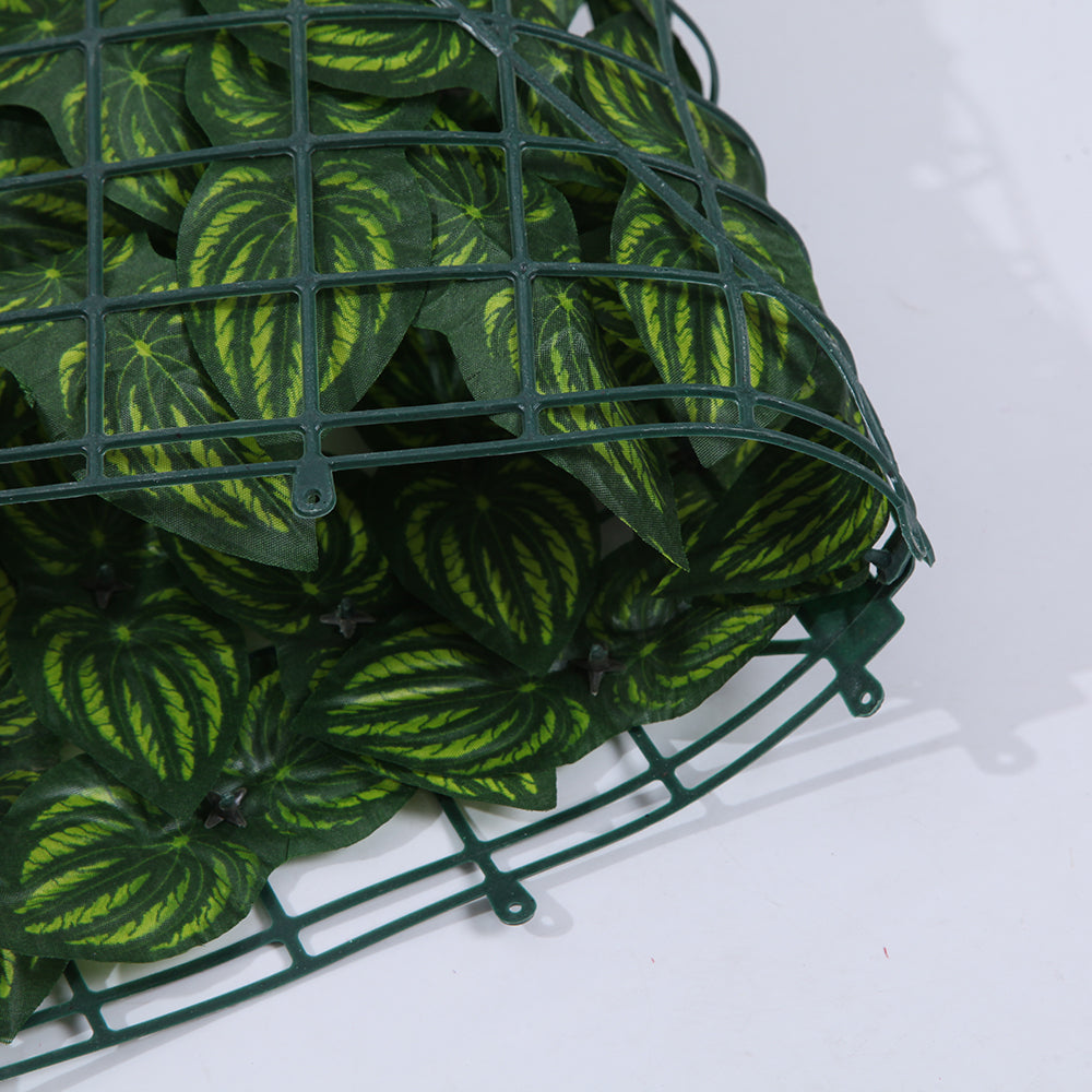 Ivy wall panels used as a greenery backdrop behind a retail display counter