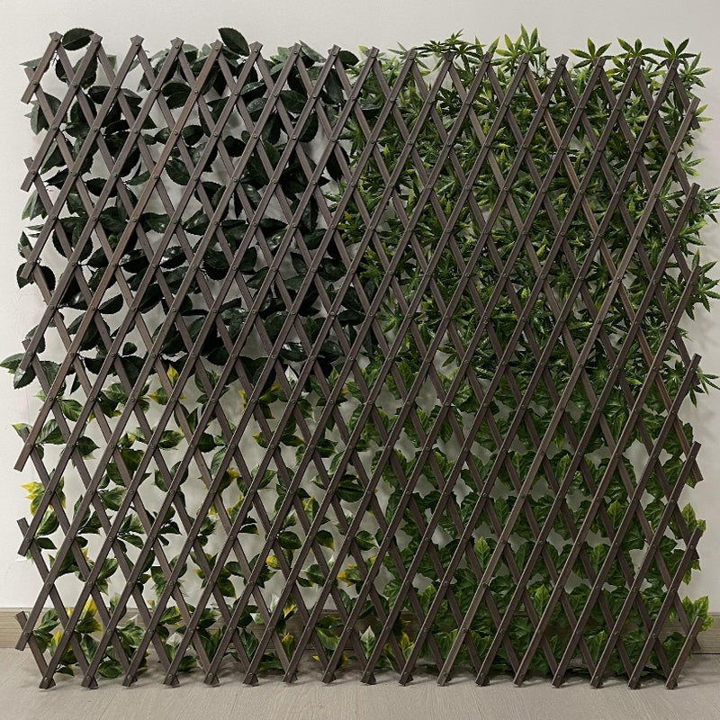 Close-up of the plastic ivy leaves showing their veining and layered green shades