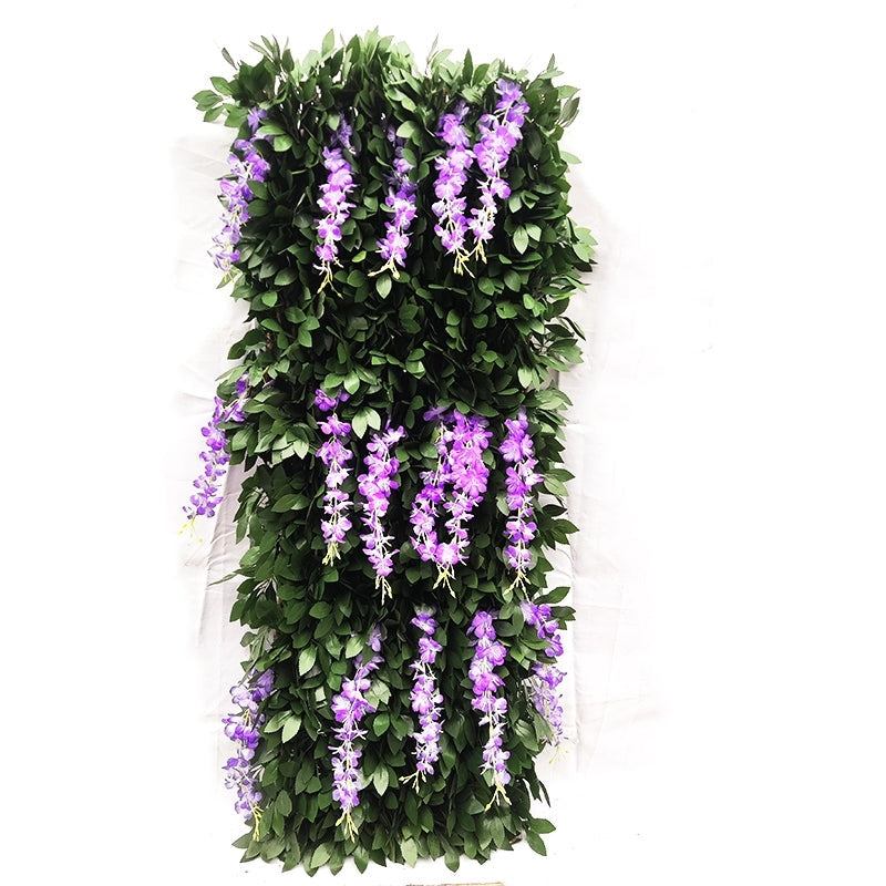Close-up of the artificial willow leaves wired along the expandable wooden trellis slats