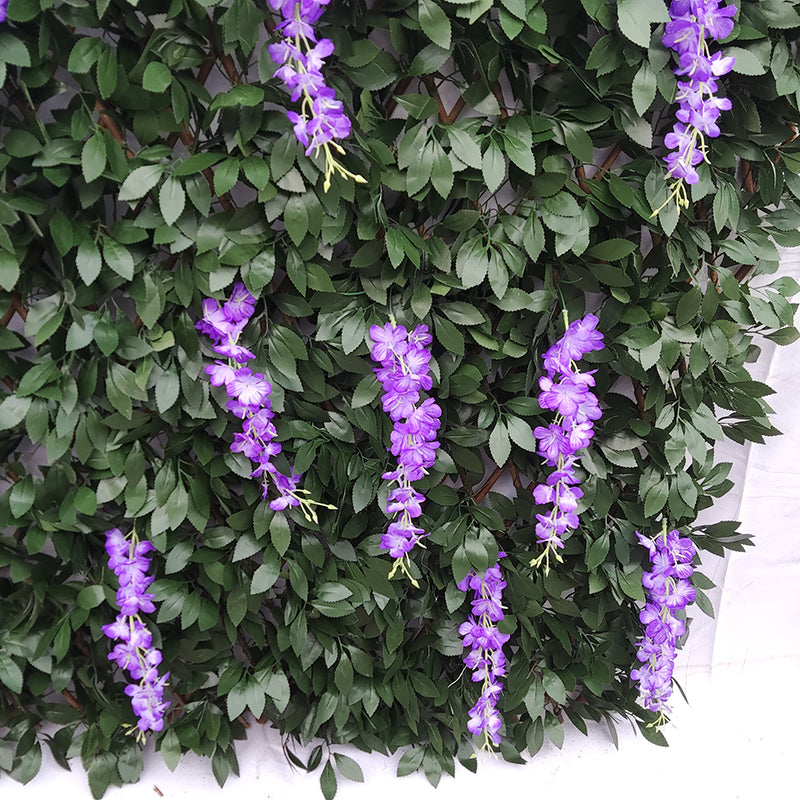 The expandable trellis stretched open to show the diamond lattice behind the foliage